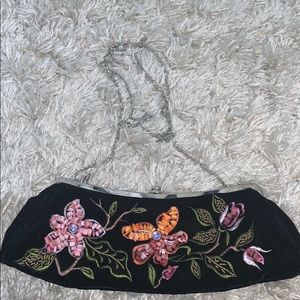 Black purse with flowers